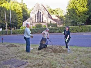 Volunteers rake-off the cut grass and flowers from the Lickey Wildflower Verge, Rose Hill.L-R: Cllr, Jill and Peter Harvey and Cllr. Kathryn Crockett.