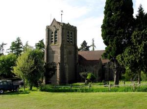 Dodford Parish church built in 1908 with "Arts and Crafts" style features and stonework embellished by the Bromsgrove Guild